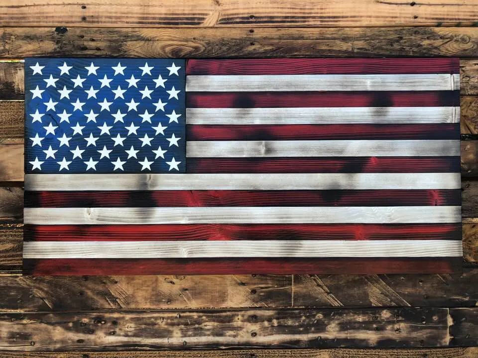 Handcrafted wooden Old Glory American flag on a rustic wood wall